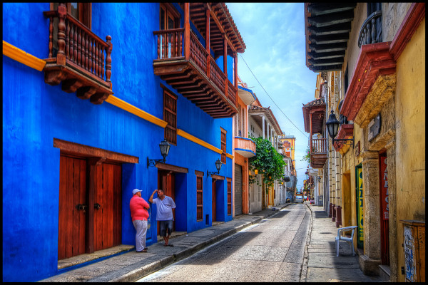 All the streets around old-town Cartagena look like this. The colors vary, but they are often strong, and lots of nice balconies. HDR of 3 handheld shots. This time Photomatix was not able to crisply align the images, but I insisted in using it because it is the only shot Ihave of this nice blue building. Cranked up the smart sharpen to make up the fuzziness, used Freaky Detail again (http://www.scottkelby.com/blog/2010/archives/8691), which is similar to Nik Tonal Contrast. For scenes with walls like these I prefer freaky detail because Tonal Contrast enhances the roughness of the walls too much. I masked the sky and street when applying freaky detail. Some dodging on the shadowed walls, and then Nik Skylight filter to give it a more sunny look.
