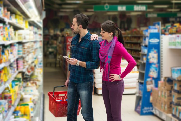 Couple Shopping At The Supermarket