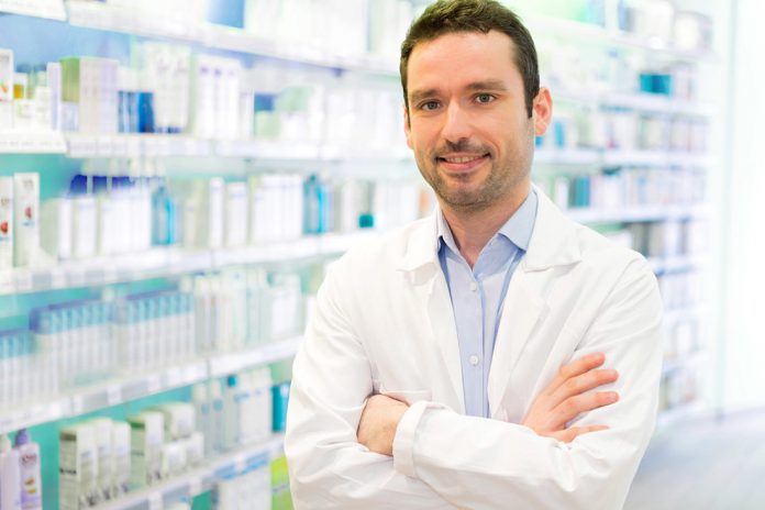 Young Attractive pharmacist at work